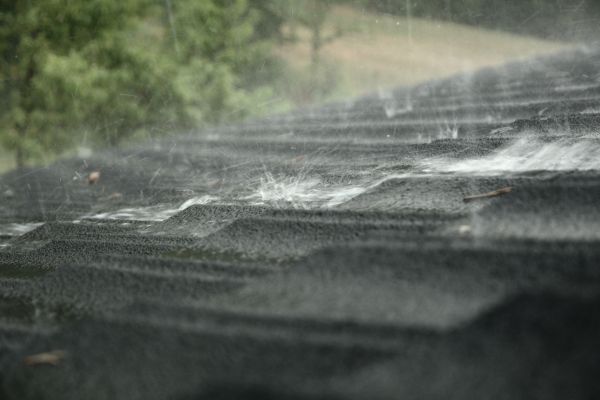 Heavy rain falling on a roof