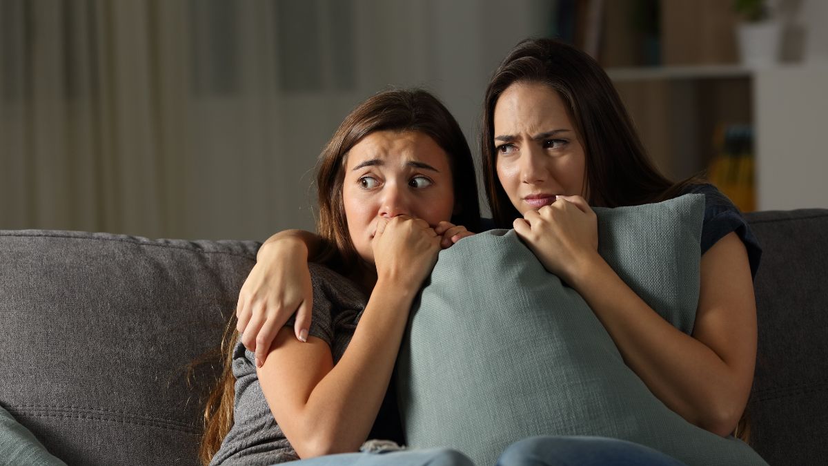 Two scared women in a home because there's inexplicable noise